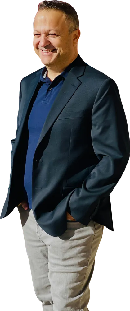 Mr. Chen Heffer smiling, in a dark blazer
